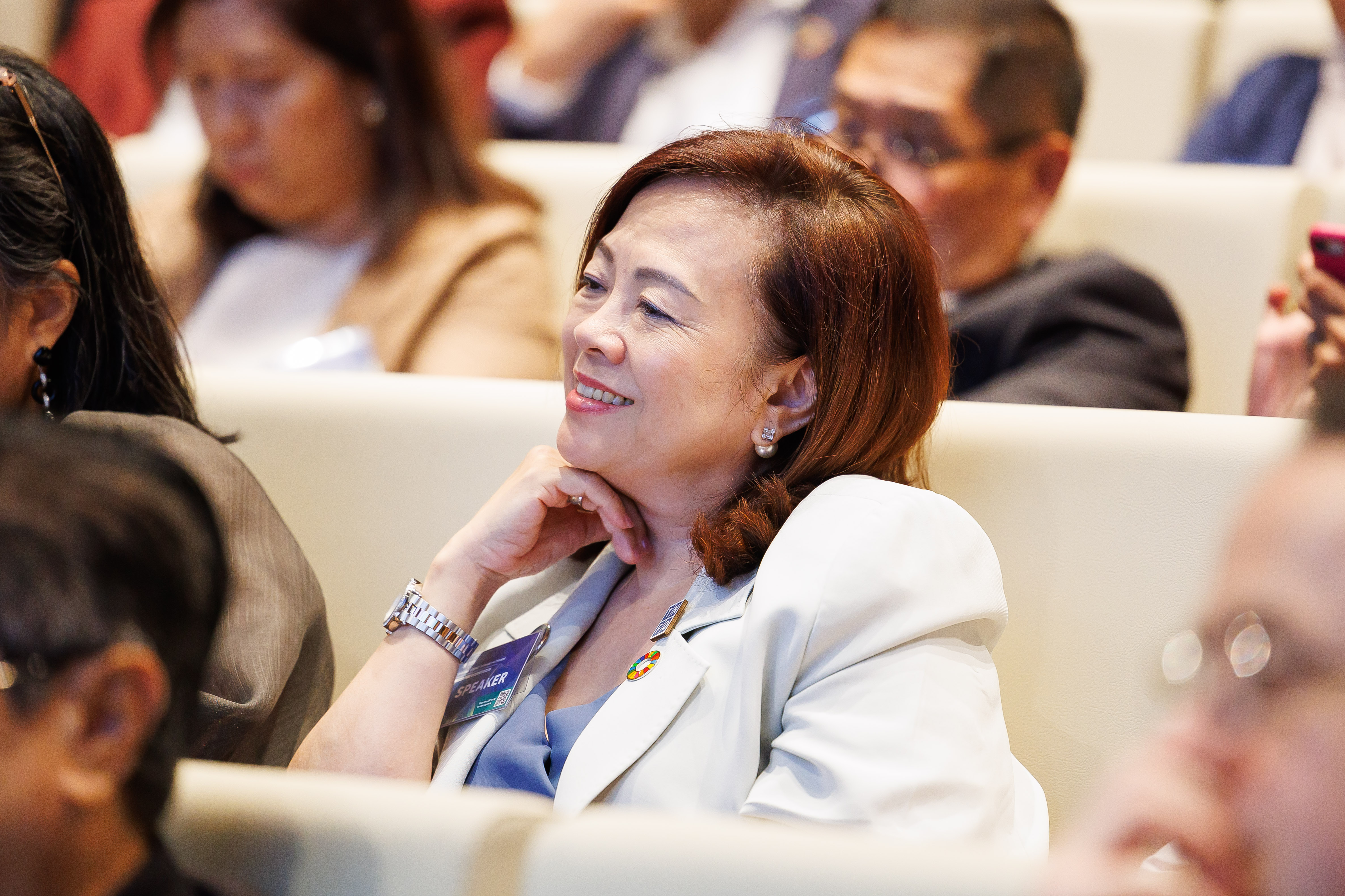 woman smiles in crowd forward faster now asia and oceania