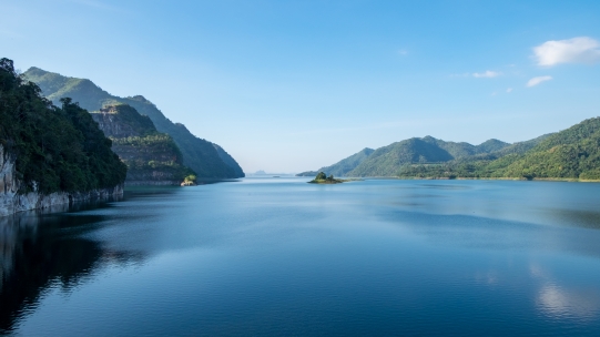 blue lake with mountains on the side